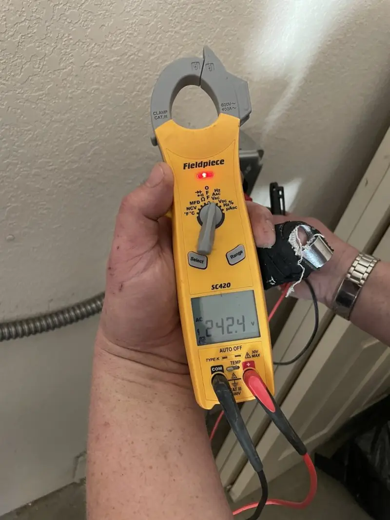 Voltage testing with clamp meter during Electrical Installation Services in Mineral Ridge